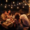 Cropped,Shot,Of,Four,Handsome,Friends,Having,Dinner,In,The